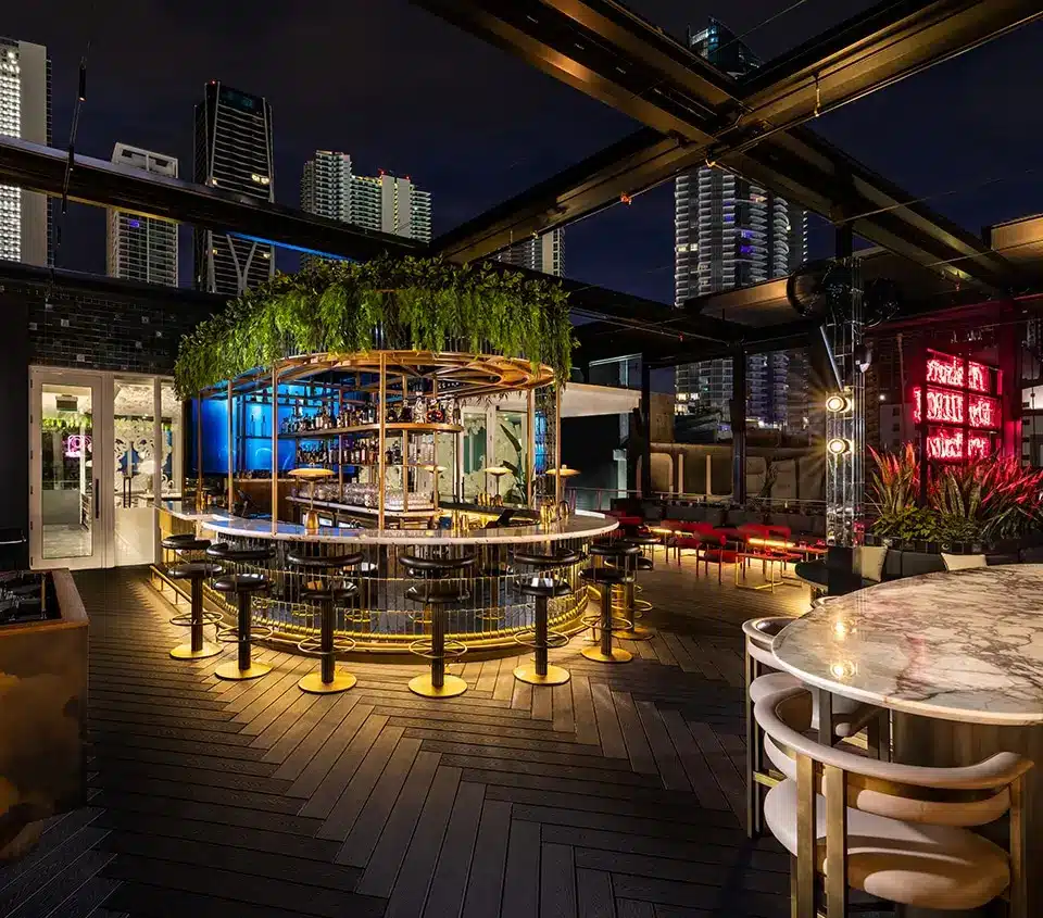 Nighttime dining scene at Giselle Miami with cocktails